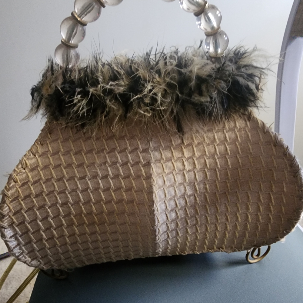 Elegant Gold Woven Handbag with Feather Trim